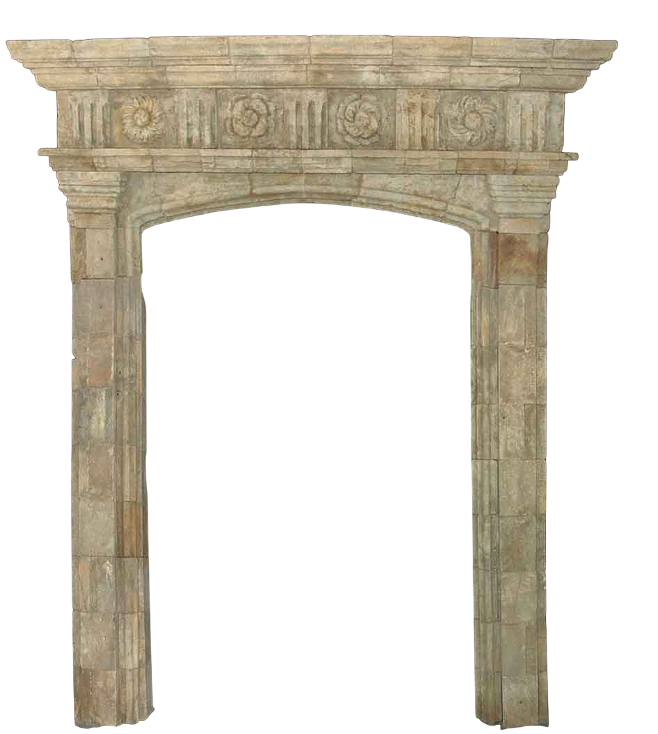 Reclaimed antique limestone entryway from Ancient Surfaces with carved rosettes across the frieze, a shallow arch and tall stone jambs