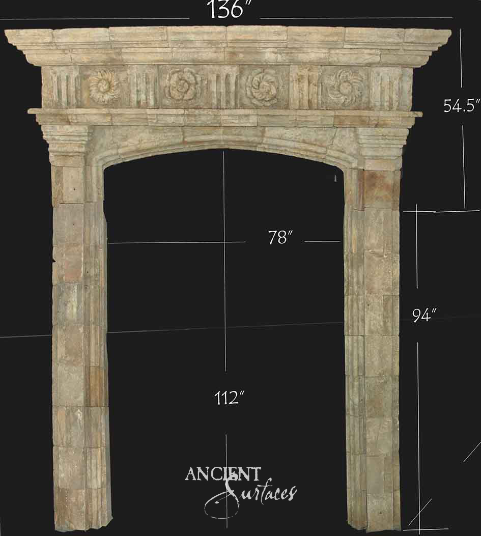 Reclaimed antique limestone entryway from Ancient Surfaces with a rosette and fluted panel frieze above fluted pilasters, photographed against black with dealer measurements marked